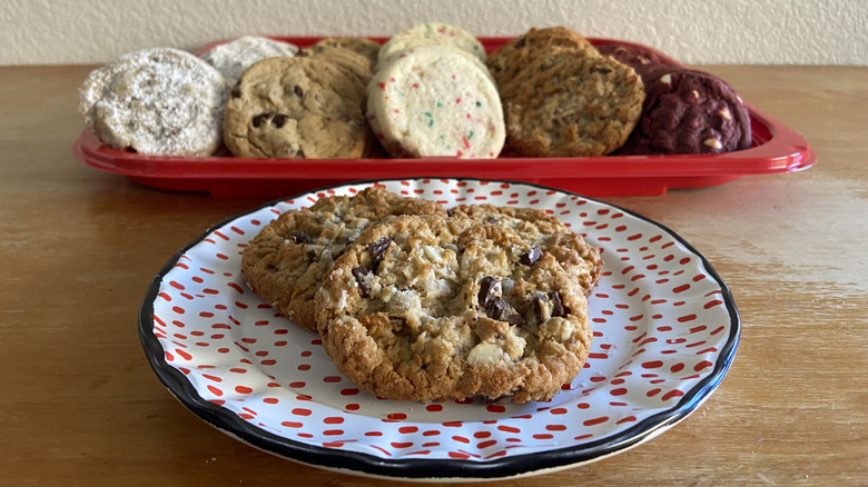 plated coconut almond cookies in front of cookie tray
