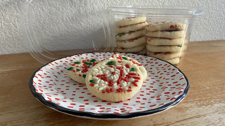 plated sugar cookies beside their container