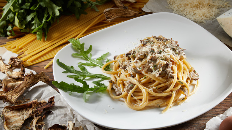 mushroom pasta on white plate