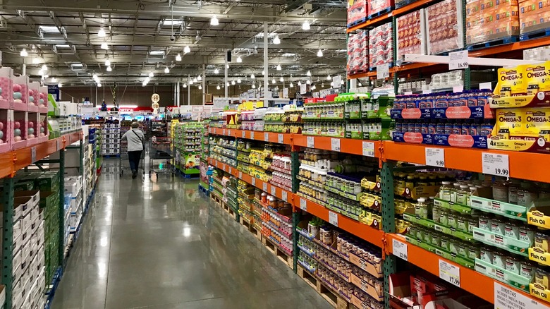 customer walking down Costco aisle