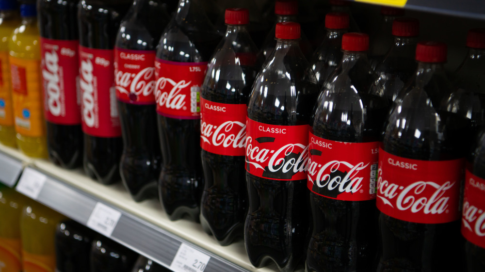 A row of Coca-Cola Bottles