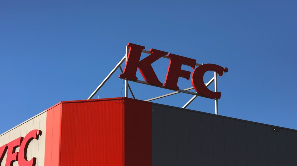 KFC! The standard of the Kentucky Fried Chicken is raised aloft for the lost and weary traveller in need of a bucket with chicken bits piled in.