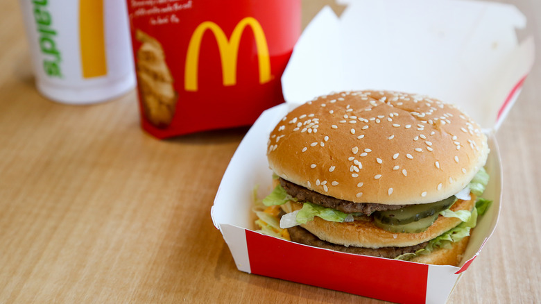 Big Mac in paper box on wood table