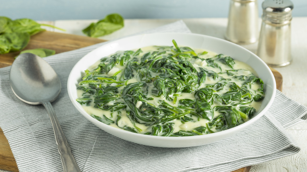 Creamed spinach in a white bowl 