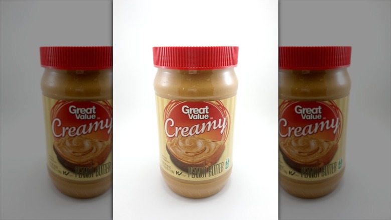 A jar of Great Value peanut butter on a white background