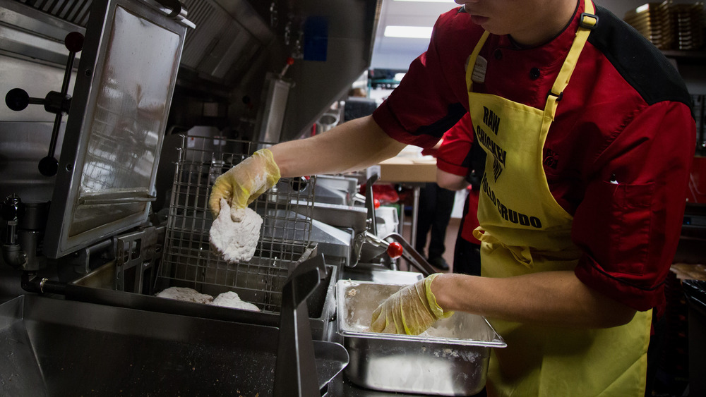 Chick-fil-A employee works the kitchen