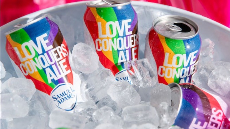 Love Conquers Ale cans in ice