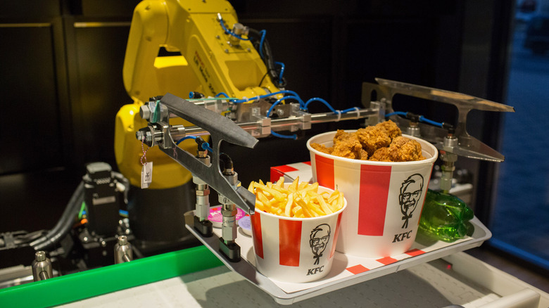 Robotic arm holding KFC meal