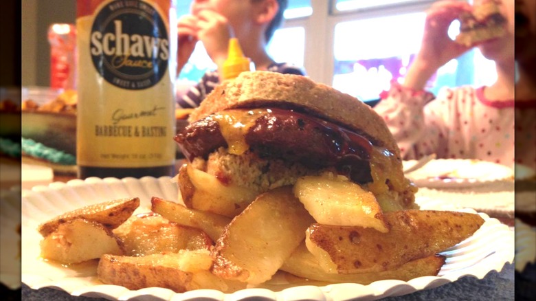 burger with Schaws sauce bottle in background