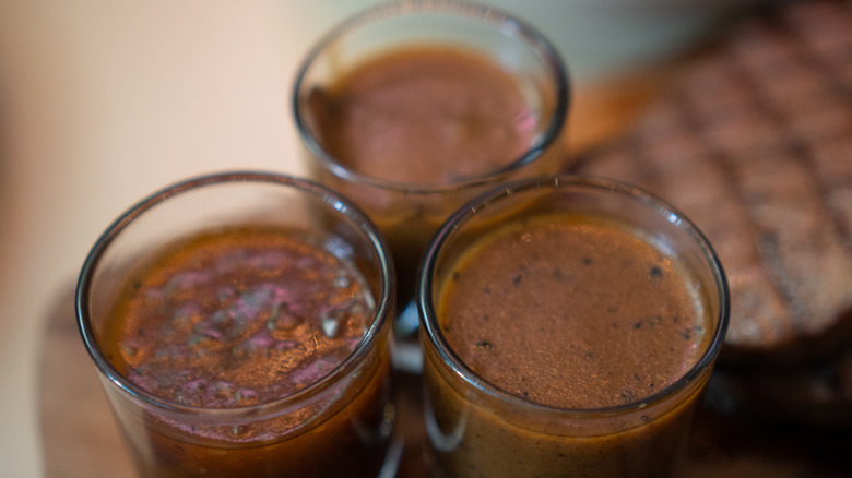 three glass jars of BBQ sauce