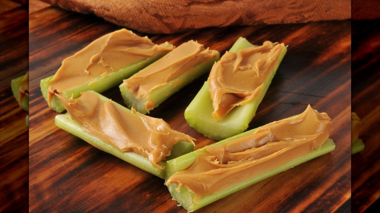 celery sticks with peanut butter smeared in the middle