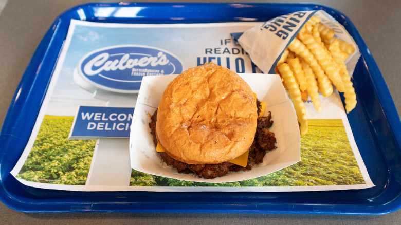 Culver's meal of a burger and fries on a blue tray