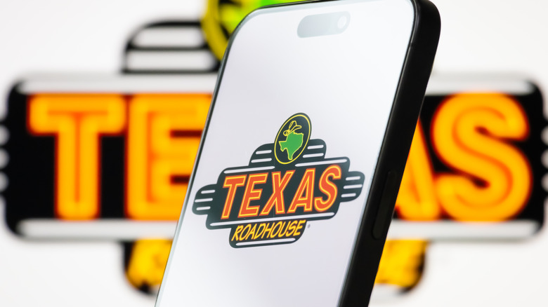 Texas Roadhouse logo on a phone