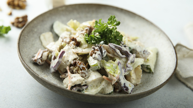 small chicken salad on a ceramic plate