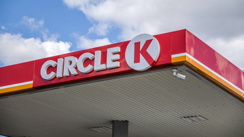 Circle K sign over cloudy blue sky