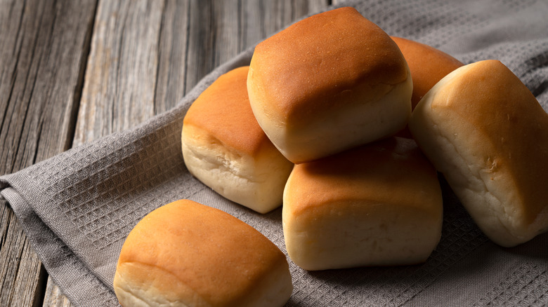 Dinner rolls on wooden table