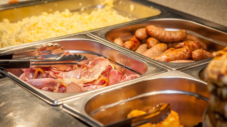 Sausage, ham, and eggs in a breakfast buffet