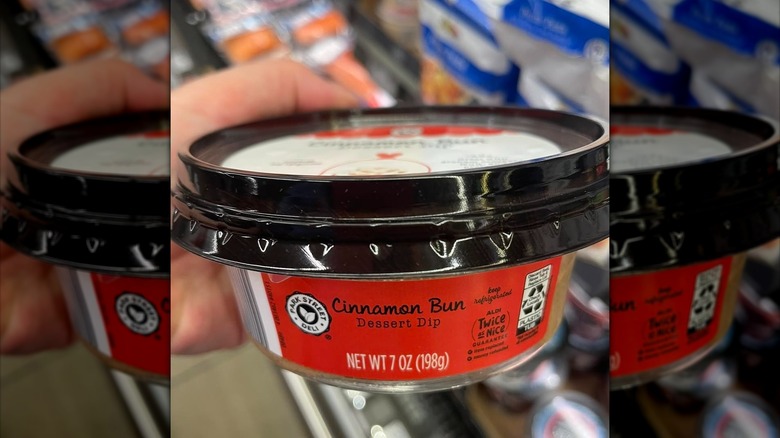 Container of cinnamon bun dessert dip