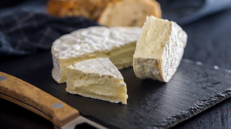 Brie cheese on a cutting board