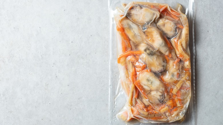 A pack of frozen oysters with seasoned vegetables