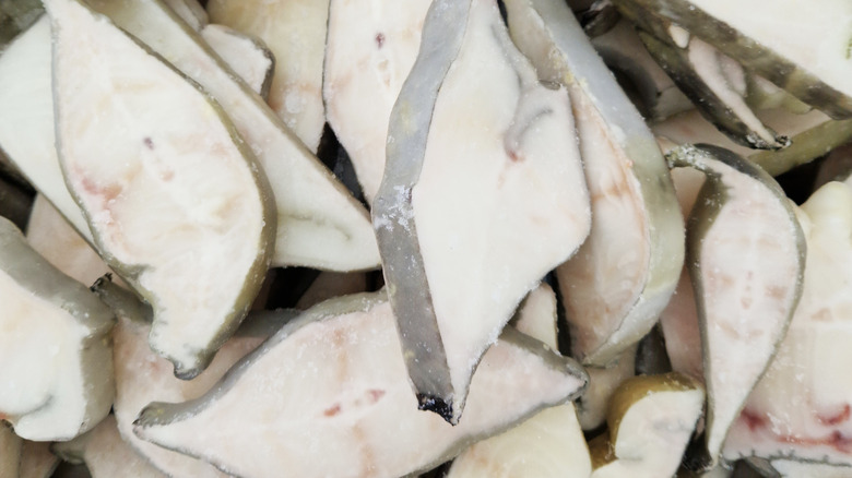 A close-up shot of frozen catfish steaks
