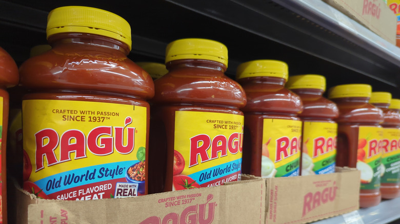 Containers of Ragu sauce on store shef