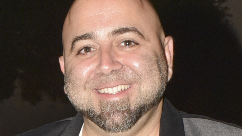 Duff Goldman smiles with beard