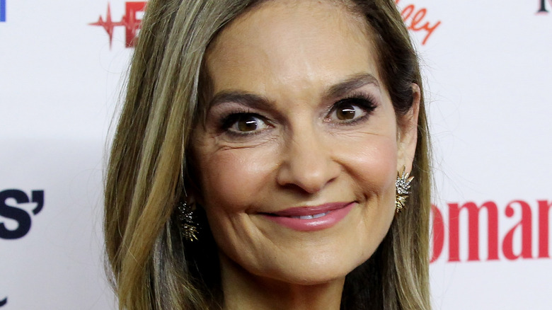 Joy Bauer wearing earrings on red carpet