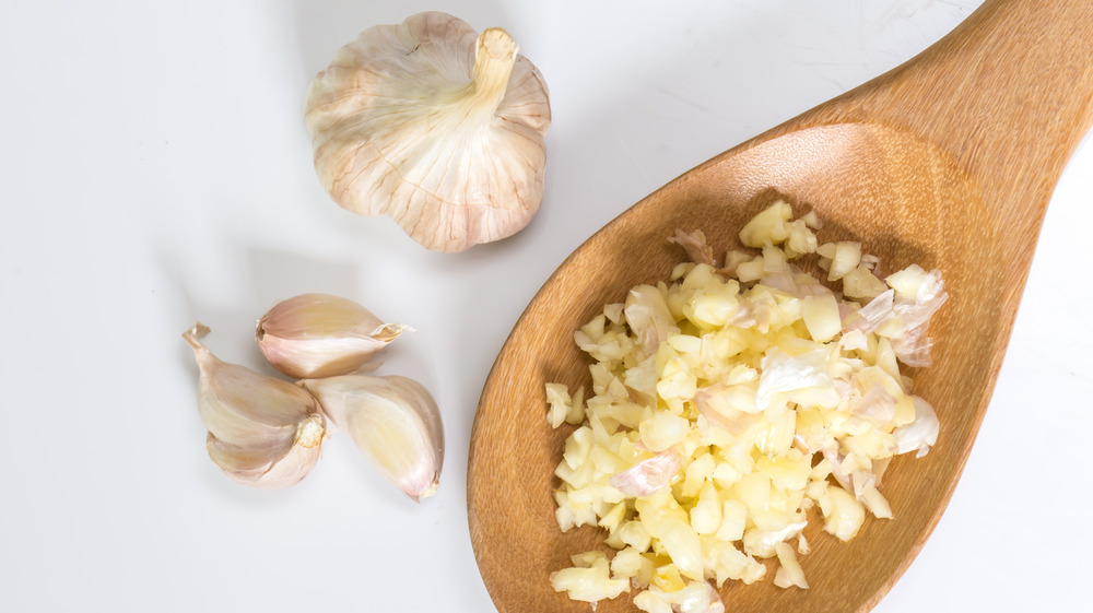 Minced garlic in a spoon