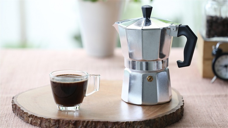 A moka pot and espresso cup