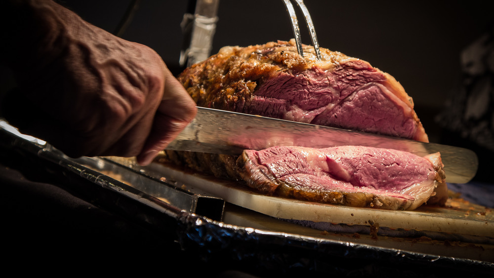 A prime rib roast being carved