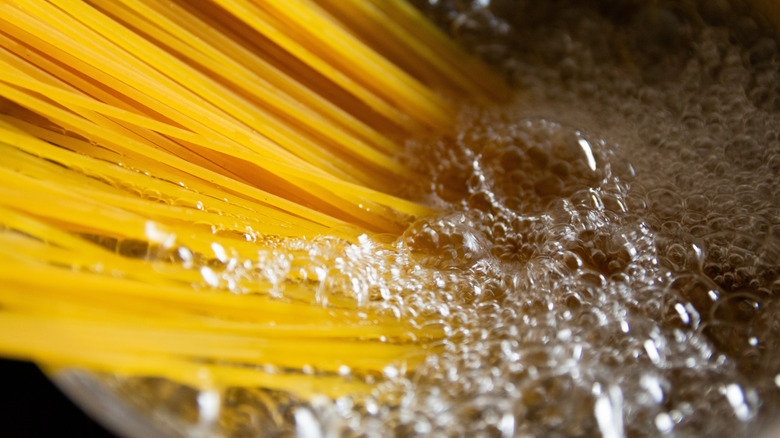 spaghetti boiling in pot