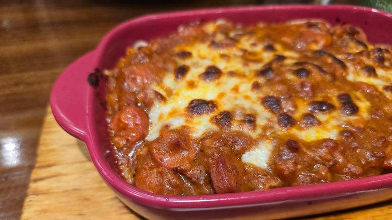 baked spaghetti bolognese in casserole dish