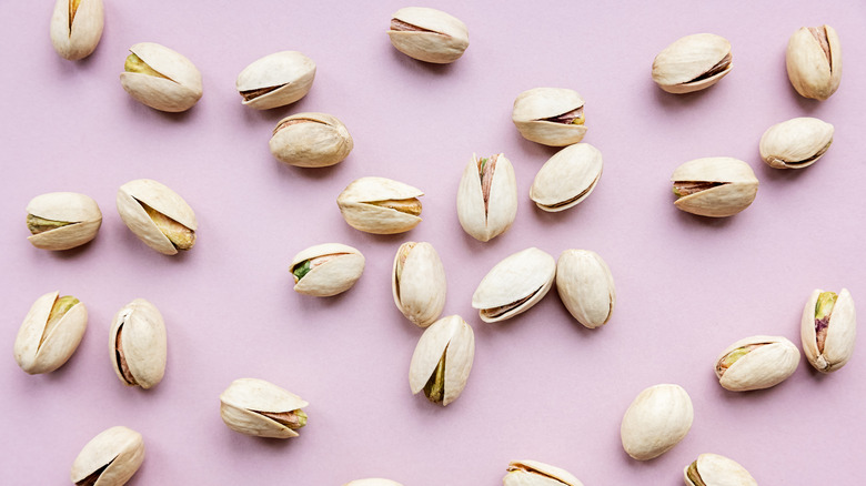 Pistachios on a pink background