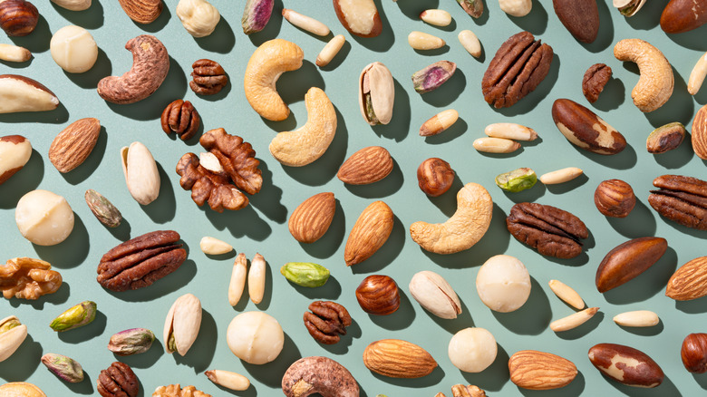 Various types of nuts on a blue background