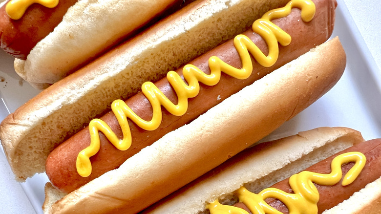 Close-up of hot dogs with mustard