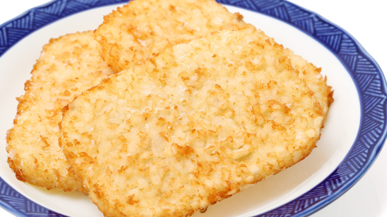 Hash brown patties on blue and white plate