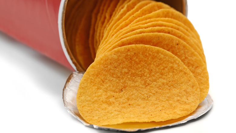 Stack of Pringles falling out of red can