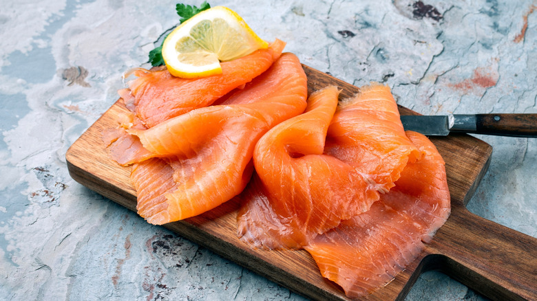 cold smoked salmon on a wooden board