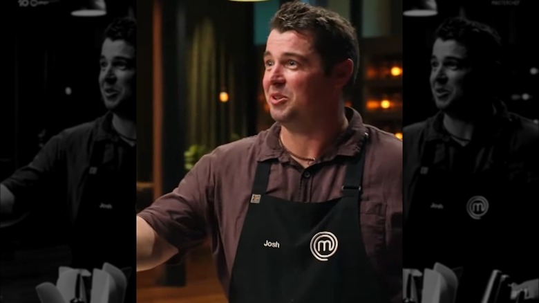Screenshot of Josh Perry smiling and cooking in MasterChef Australia season 16