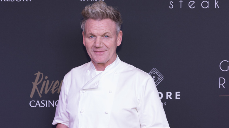 Gordon Ramsay smiling in a white chef uniform