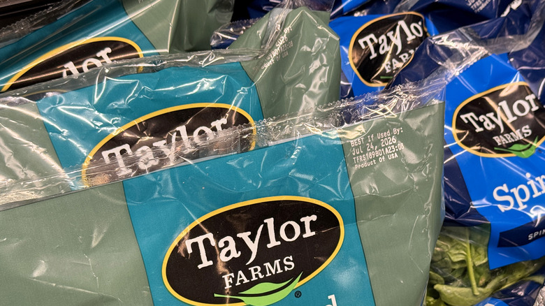 Bags of Taylor Farms ready made veggies inside grocery store.