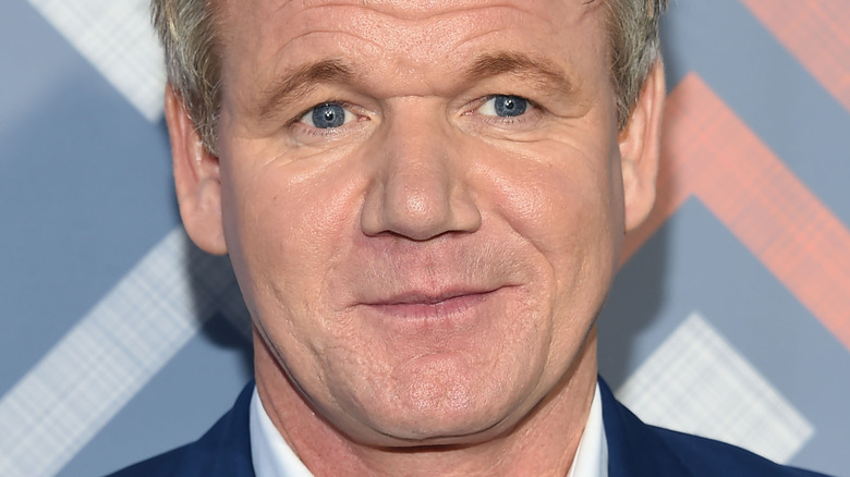Gordon Ramsay looking to the side and smirking