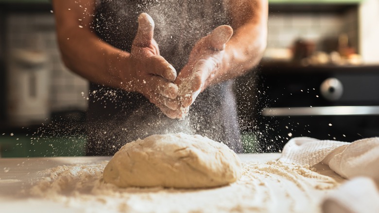 Man makes pasta dough