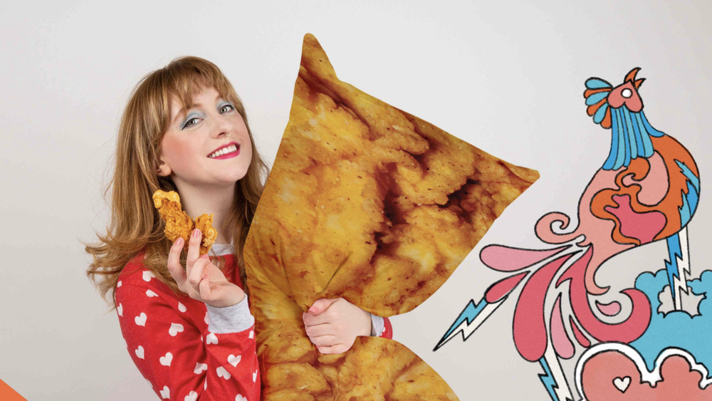 Girl holding A&W chicken tender body pillow