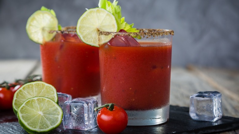 two Bloody Mary glasses with lime