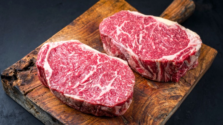 2 Wagyu steaks on cutting board