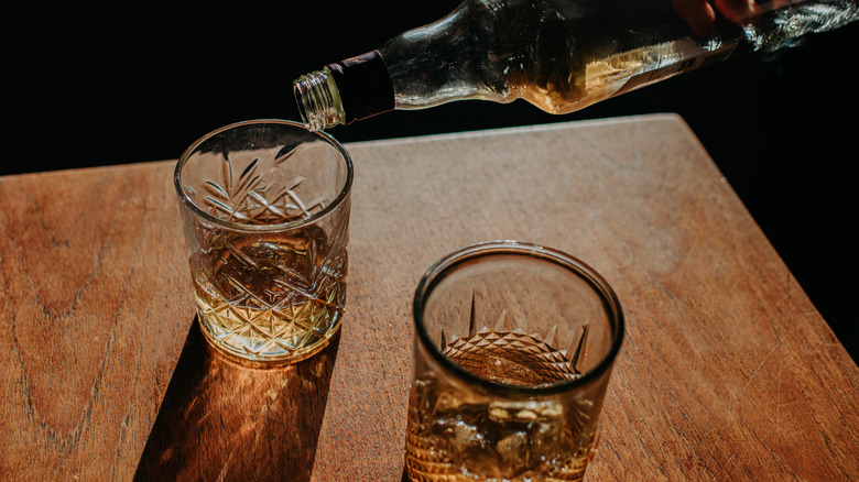 Pouring bourbon into glasses