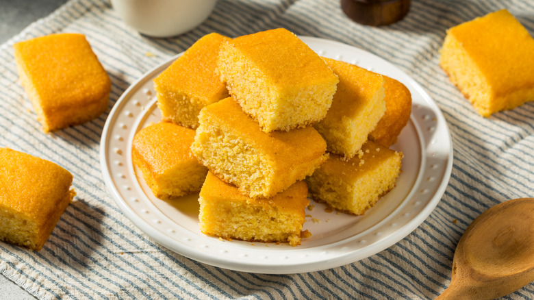 squares of homemade cornbread on a white plate