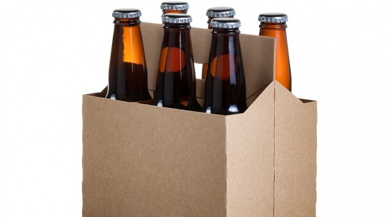 six-pack unlabeled opaque bottles